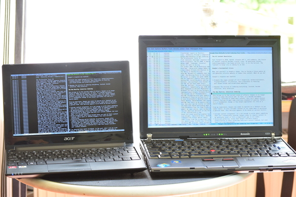 Photo of the Acer Aspire One next to a ThinkPad X201